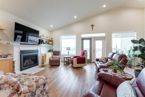 202 Lake Drive, Coalhurst, AB - Indoor Photo Showing Living Room With Fireplace