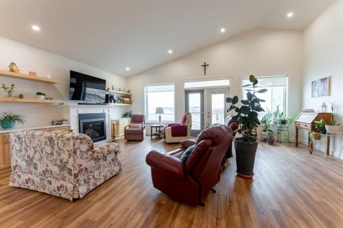 202 Lake Drive, Coalhurst, AB - Indoor Photo Showing Living Room With Fireplace