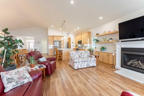 202 Lake Drive, Coalhurst, AB - Indoor Photo Showing Living Room With Fireplace