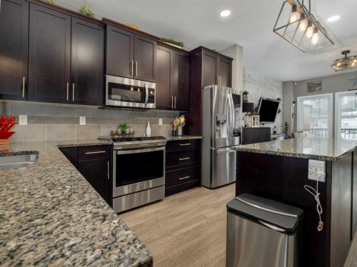 527 Moonlight Lane West, Lethbridge, AB - Indoor Photo Showing Kitchen With Double Sink With Upgraded Kitchen