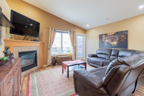 73 Heritage Circle West, Lethbridge, AB - Indoor Photo Showing Living Room With Fireplace
