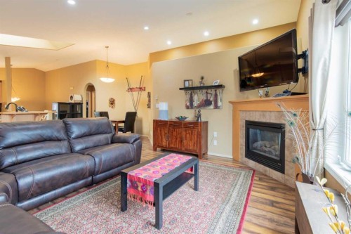 73 Heritage Circle West, Lethbridge, AB - Indoor Photo Showing Living Room With Fireplace