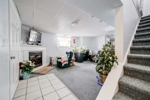 109 Argyle Street, Granum, AB - Indoor Photo Showing Other Room With Fireplace