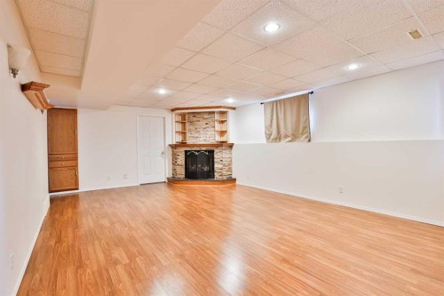 1012 24 Avenue, Coaldale, AB - Indoor With Fireplace