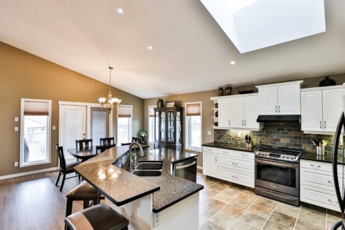 92 Heritage Circle West, Lethbridge, AB - Indoor Photo Showing Kitchen With Double Sink