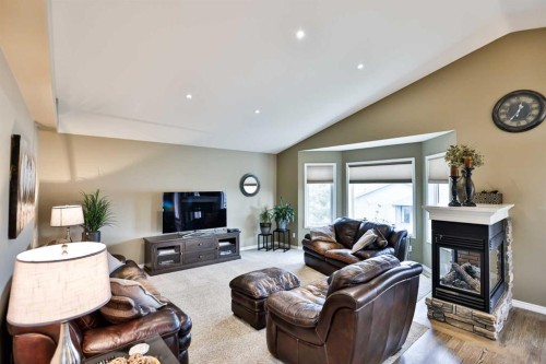 92 Heritage Circle West, Lethbridge, AB - Indoor Photo Showing Living Room With Fireplace
