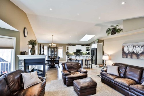 92 Heritage Circle West, Lethbridge, AB - Indoor Photo Showing Living Room With Fireplace