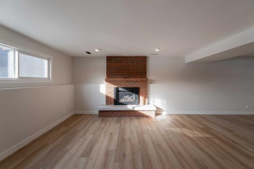 86 Carleton Place West, Lethbridge, AB - Indoor Photo Showing Living Room With Fireplace