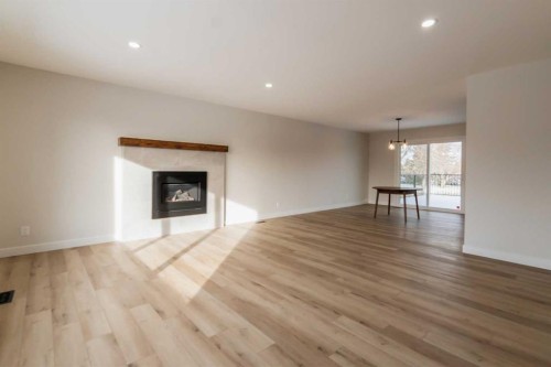 86 Carleton Place West, Lethbridge, AB - Indoor Photo Showing Living Room With Fireplace