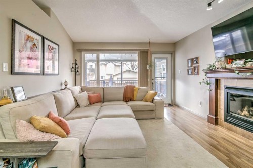 78 Coalbanks Gate West, Lethbridge, AB - Indoor Photo Showing Living Room With Fireplace