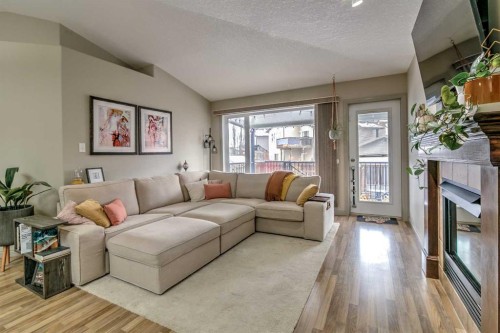 78 Coalbanks Gate West, Lethbridge, AB - Indoor Photo Showing Living Room With Fireplace