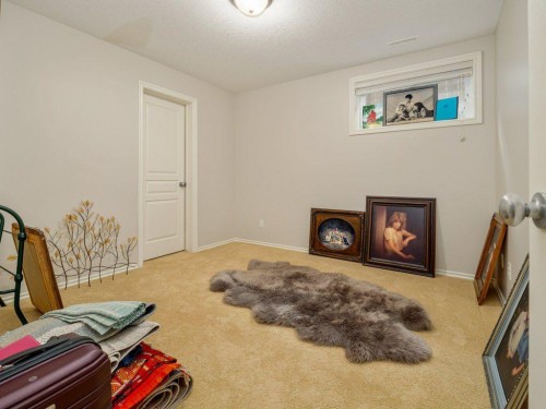 22 Riverstone Boulevard West, Lethbridge, AB - Indoor With Fireplace