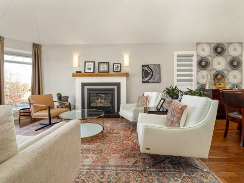 22 Riverstone Boulevard West, Lethbridge, AB - Indoor Photo Showing Living Room With Fireplace