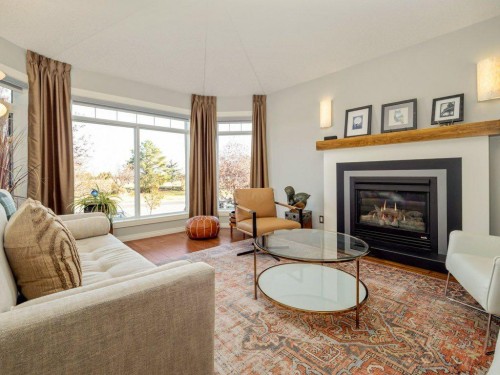 22 Riverstone Boulevard West, Lethbridge, AB - Indoor Photo Showing Living Room With Fireplace