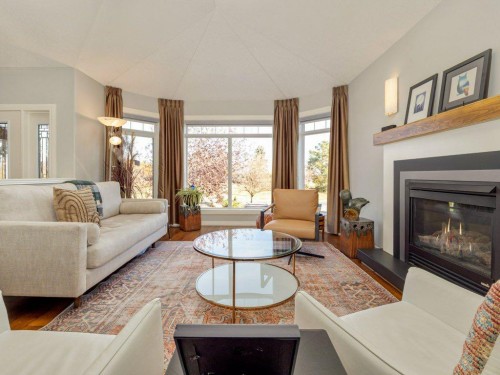 22 Riverstone Boulevard West, Lethbridge, AB - Indoor Photo Showing Living Room With Fireplace