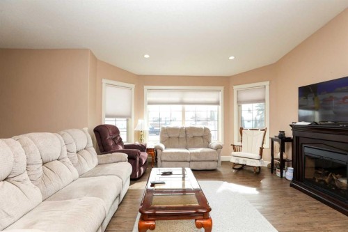 5103 62 Avenue, Taber, AB - Indoor Photo Showing Living Room With Fireplace