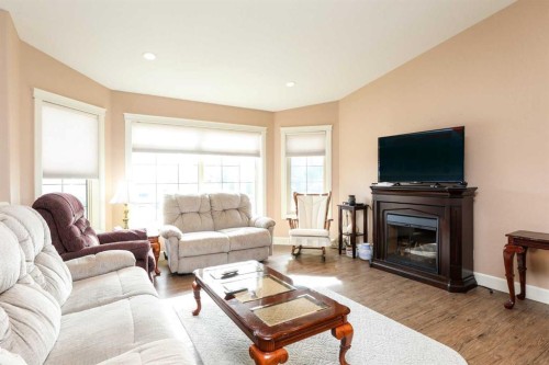 5103 62 Avenue, Taber, AB - Indoor Photo Showing Living Room With Fireplace