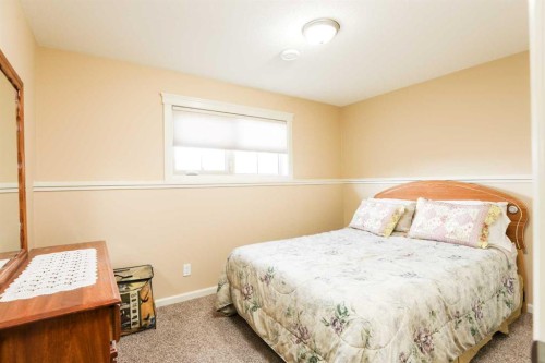 5103 62 Avenue, Taber, AB - Indoor Photo Showing Bedroom
