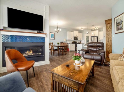 514 Mary Cameron Crescent North, Lethbridge, AB - Indoor Photo Showing Living Room With Fireplace