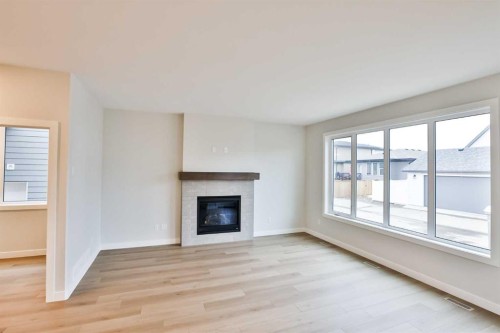 668 Devonia Road West, Lethbridge, AB - Indoor Photo Showing Living Room With Fireplace