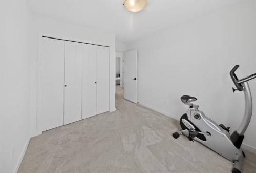 302 Uplands Boulevard North, Lethbridge, AB - Indoor Photo Showing Gym Room