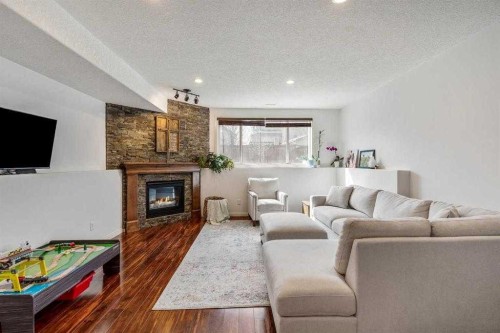 70 Coalbanks Gate West, Lethbridge, AB - Indoor Photo Showing Living Room With Fireplace
