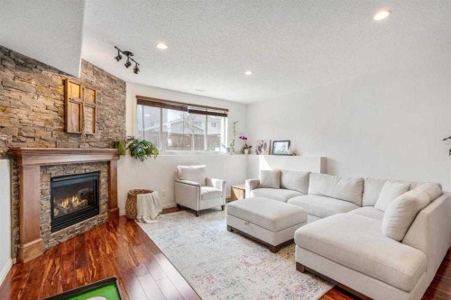 70 Coalbanks Gate West, Lethbridge, AB - Indoor Photo Showing Living Room With Fireplace