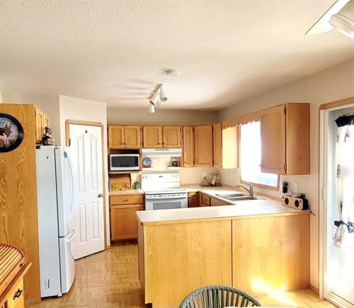 72 Owens Close, Red Deer, AB - Indoor Photo Showing Kitchen With Double Sink