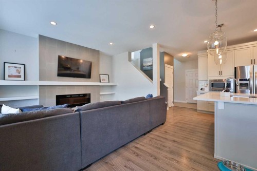 283 Northlander Bend West, Lethbridge, AB - Indoor Photo Showing Kitchen With Fireplace With Upgraded Kitchen