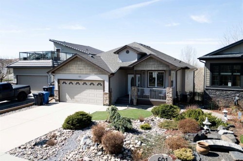 605 Sunridge Crescent West, Lethbridge, AB - Outdoor With Facade