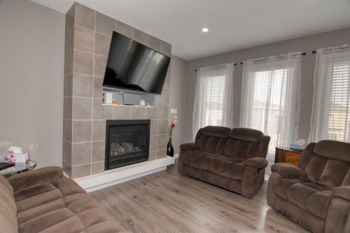 559 Moonlight Lane West, Lethbridge, AB - Indoor Photo Showing Living Room With Fireplace