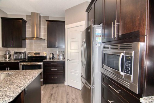 559 Moonlight Lane West, Lethbridge, AB - Indoor Photo Showing Kitchen With Upgraded Kitchen