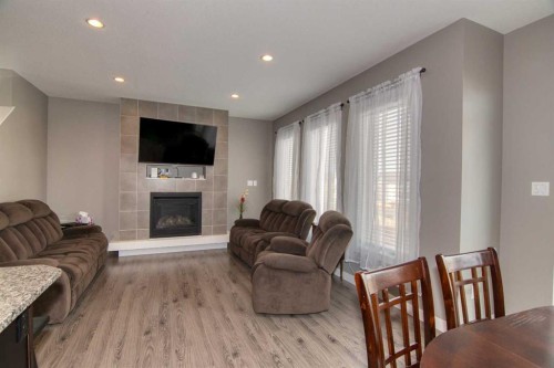 559 Moonlight Lane West, Lethbridge, AB - Indoor Photo Showing Living Room With Fireplace