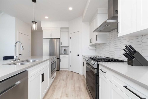1180 Coalbrook Place West, Lethbridge, AB - Indoor Photo Showing Kitchen With Stainless Steel Kitchen With Double Sink With Upgraded Kitchen