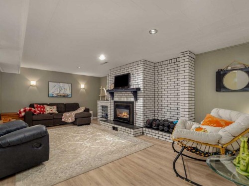 1707 Lakemount Boulevard South, Lethbridge, AB - Indoor Photo Showing Living Room With Fireplace