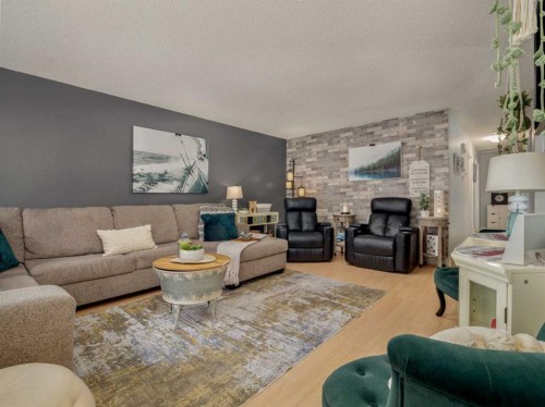 1707 Lakemount Boulevard South, Lethbridge, AB - Indoor Photo Showing Living Room With Fireplace