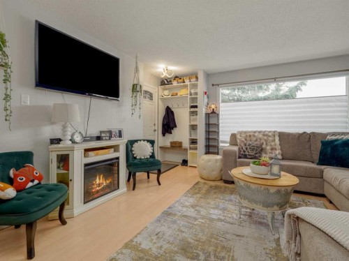 1707 Lakemount Boulevard South, Lethbridge, AB - Indoor Photo Showing Living Room With Fireplace