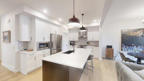 28 Aster Link, Okotoks, AB - Indoor Photo Showing Kitchen With Double Sink With Upgraded Kitchen