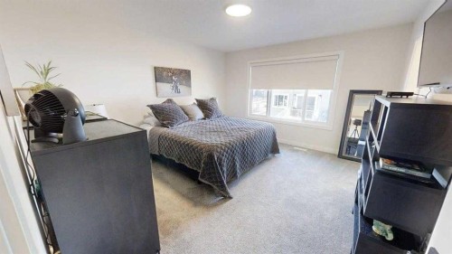 28 Aster Link, Okotoks, AB - Indoor Photo Showing Bedroom