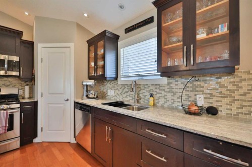 320 S 200 W, Raymond, AB - Indoor Photo Showing Kitchen With Double Sink