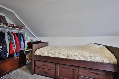 54 S 200 W, Raymond, AB - Indoor Photo Showing Bedroom