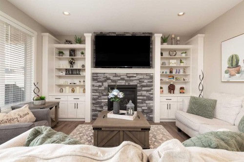 129 Sixmile Bend South, Lethbridge, AB - Indoor Photo Showing Living Room With Fireplace