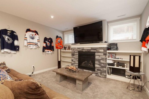 129 Sixmile Bend South, Lethbridge, AB - Indoor Photo Showing Living Room With Fireplace