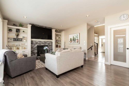 129 Sixmile Bend South, Lethbridge, AB - Indoor Photo Showing Living Room With Fireplace