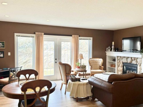 2-373 Canyon Boulevard West, Lethbridge, AB - Indoor Photo Showing Living Room With Fireplace