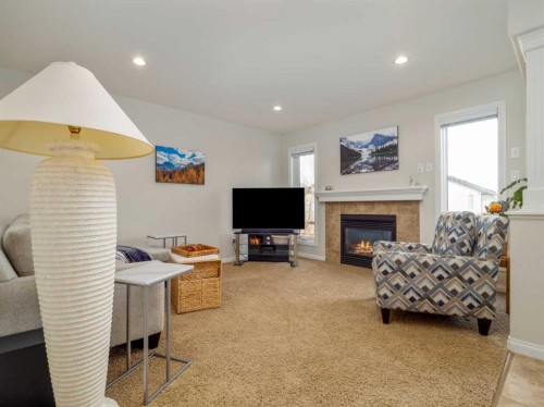 1601 Coalbanks Boulevard West, Lethbridge, AB - Indoor Photo Showing Living Room With Fireplace