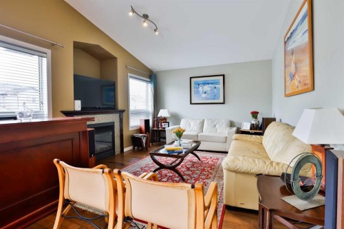 66 Coalbanks Gate West, Lethbridge, AB - Indoor Photo Showing Living Room With Fireplace