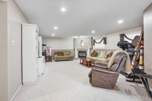 41 Heritage Circle West, Lethbridge, AB - Indoor Photo Showing Other Room With Fireplace