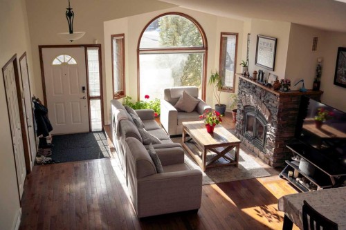 46 Heritage Place West, Lethbridge, AB - Indoor Photo Showing Living Room With Fireplace