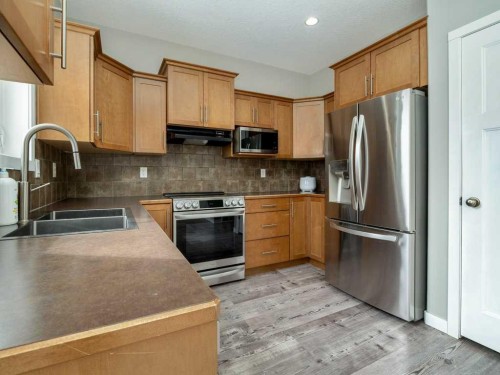 146 Silkstone Road West, Lethbridge, AB - Indoor Photo Showing Kitchen With Double Sink